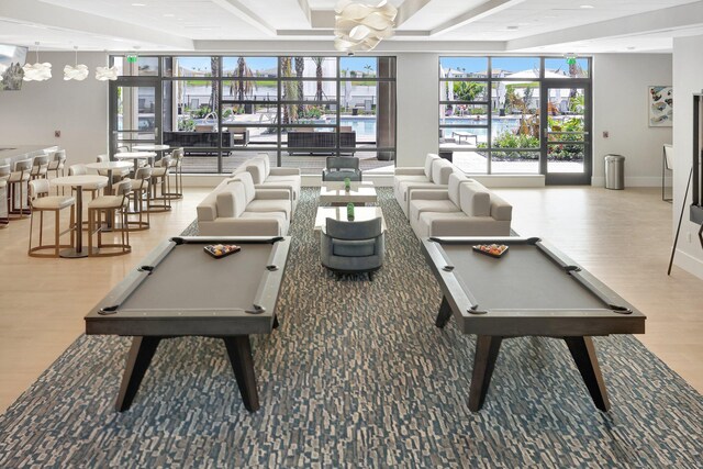 game room featuring beamed ceiling, hardwood / wood-style floors, and billiards