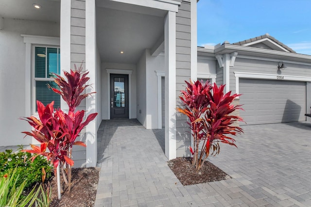 entrance to property featuring a garage