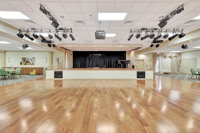 misc room featuring a paneled ceiling and light hardwood / wood-style floors