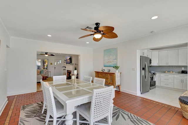 dining space featuring visible vents, a ceiling fan, baseboards, and recessed lighting