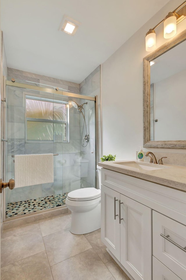 bathroom with radiator heating unit, vanity, a stall shower, and toilet