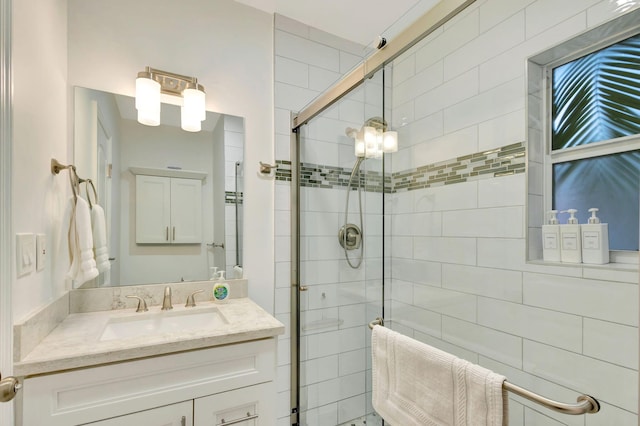 bathroom with vanity and walk in shower