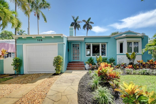 single story home featuring a garage