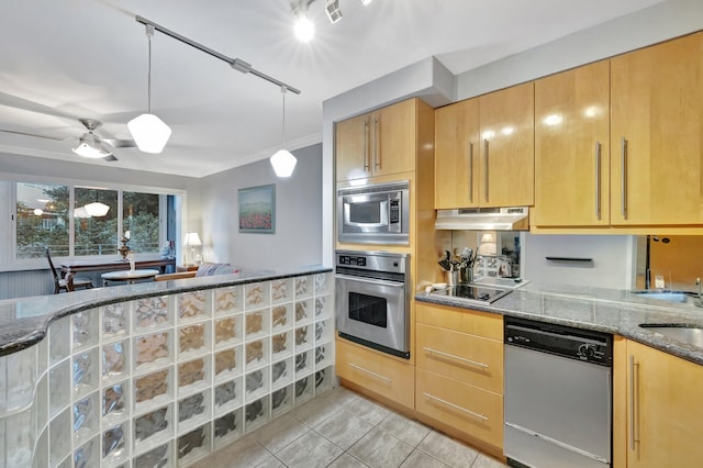 kitchen featuring light stone countertops, appliances with stainless steel finishes, rail lighting, light brown cabinetry, and ceiling fan