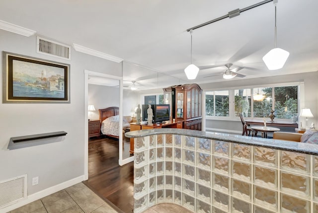 bedroom featuring tile patterned floors and ornamental molding