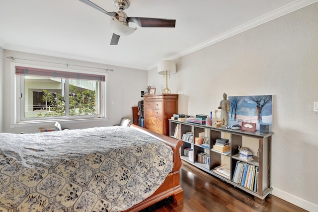 bedroom featuring crown molding, ceiling fan, and dark wood-type flooring