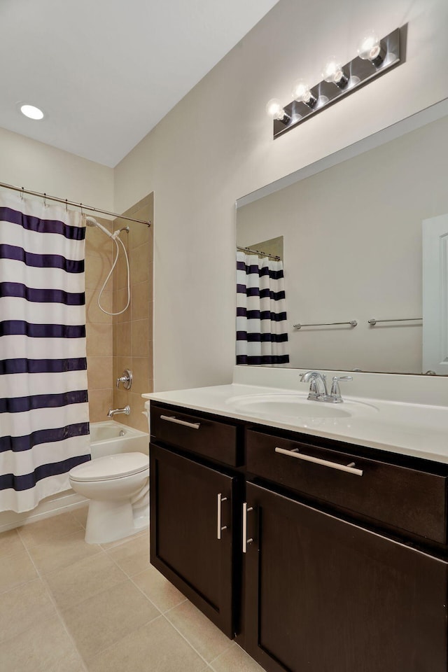 full bathroom with tile patterned flooring, vanity, shower / tub combo, and toilet