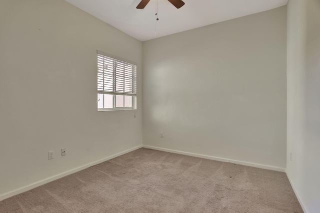 unfurnished room with ceiling fan and carpet floors