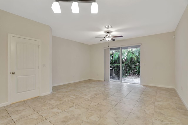 tiled empty room with ceiling fan