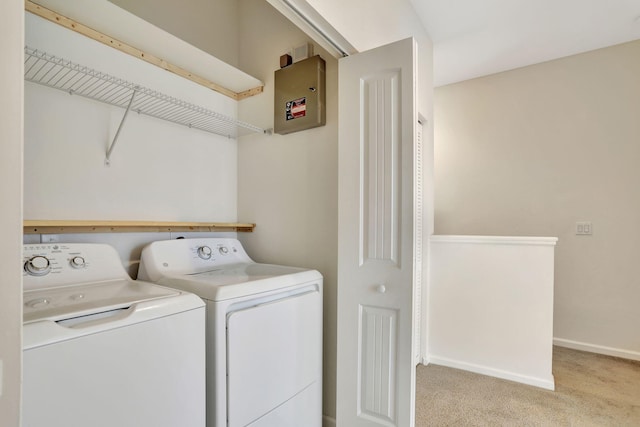 washroom featuring washing machine and dryer and light carpet