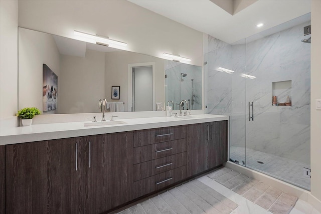 bathroom featuring tile patterned flooring, vanity, and walk in shower