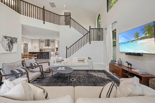 living room with a towering ceiling