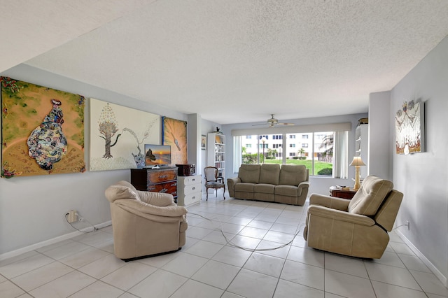 tiled living room with ceiling fan and a textured ceiling