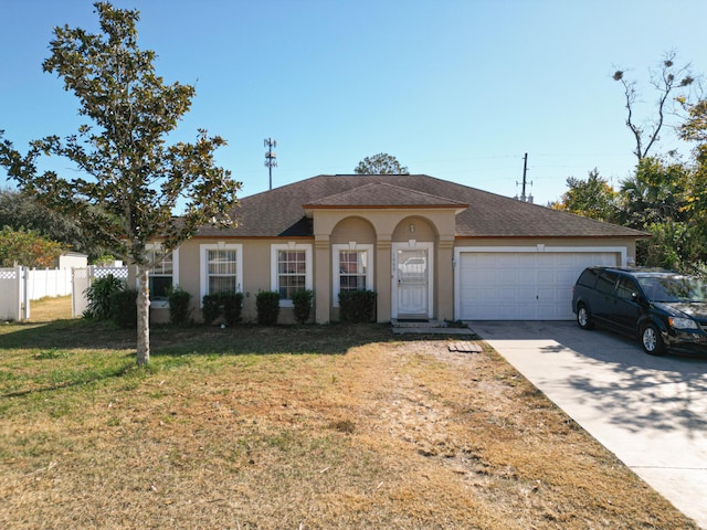 view of front facade featuring a garage and a front yard