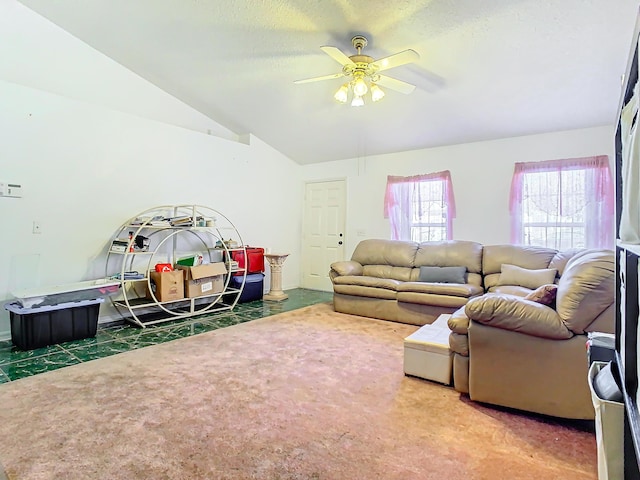 carpeted living room featuring ceiling fan, lofted ceiling, and a textured ceiling