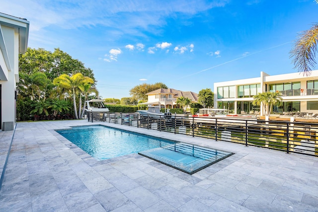 view of pool with a patio area and a fenced in pool