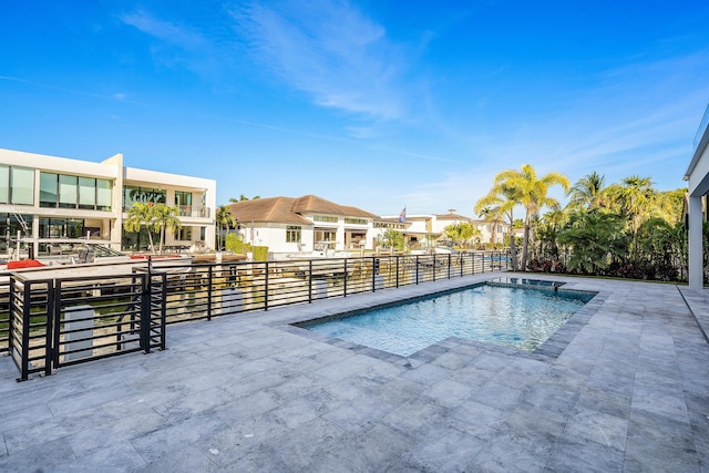 view of swimming pool featuring a patio area and a fenced in pool