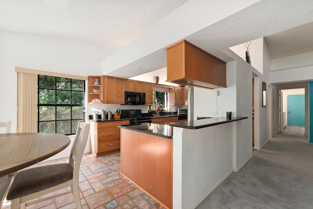 kitchen featuring high vaulted ceiling, black appliances, sink, a textured ceiling, and light colored carpet