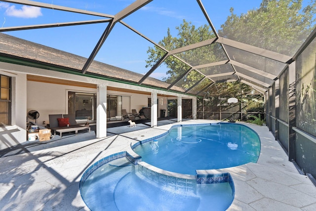 view of swimming pool featuring outdoor lounge area, a patio, and glass enclosure