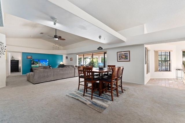 dining space featuring light carpet, a wealth of natural light, lofted ceiling, and ceiling fan