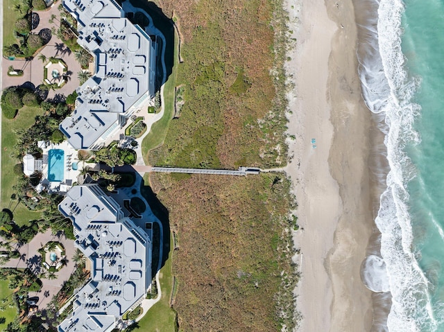 bird's eye view featuring a beach view and a water view