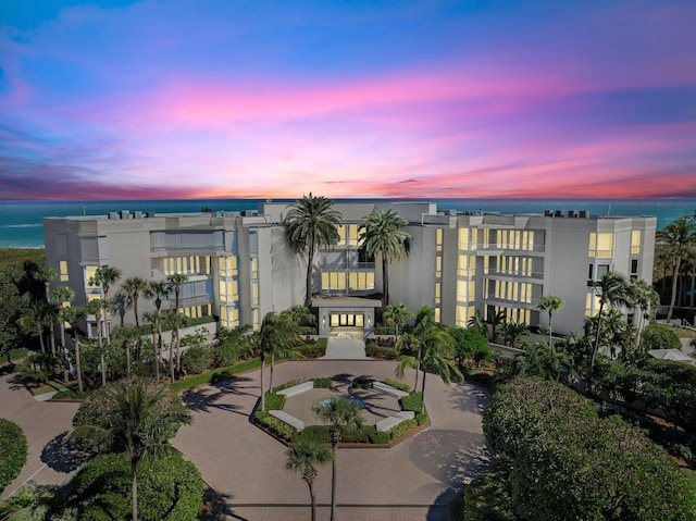 outdoor building at dusk featuring a water view