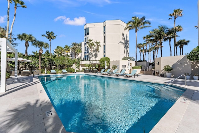 view of swimming pool featuring a patio area