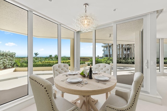 sunroom with a chandelier