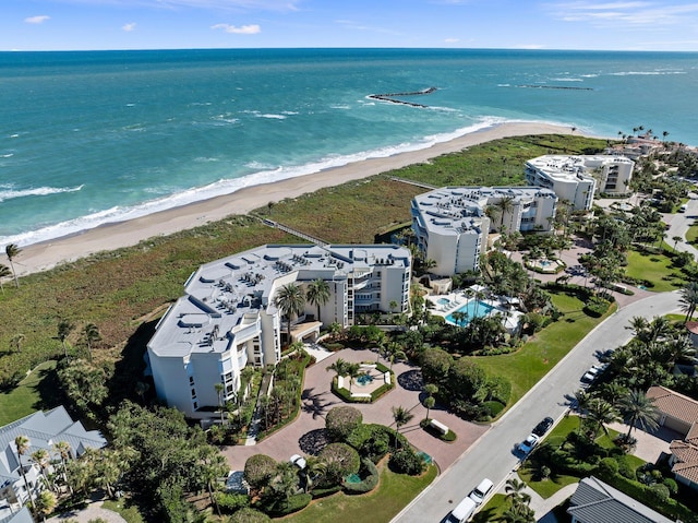 aerial view with a water view and a beach view