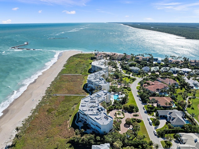 drone / aerial view with a beach view and a water view