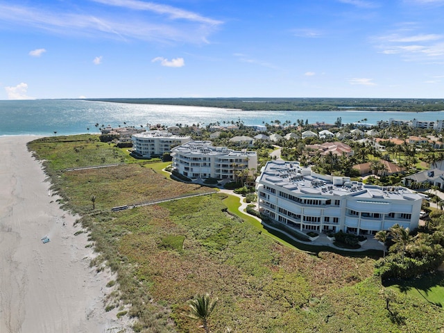 aerial view featuring a water view and a view of the beach