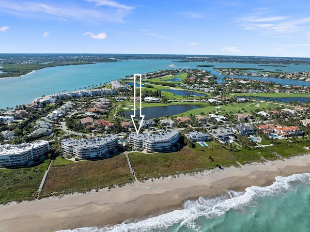 bird's eye view with a water view and a view of the beach