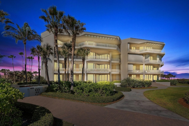 view of outdoor building at dusk