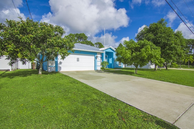 single story home featuring a front yard and a garage