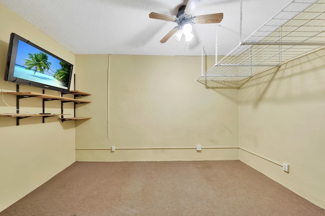 unfurnished room with ceiling fan and carpet floors