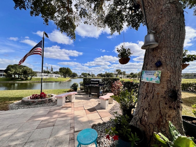 view of patio / terrace featuring a water view and area for grilling