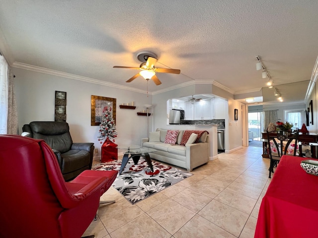 living room with light tile patterned flooring, ornamental molding, and a textured ceiling