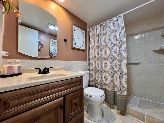 bathroom featuring a shower with curtain, vanity, toilet, and tile walls