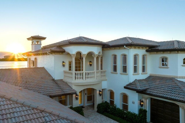 exterior space featuring a balcony and a garage