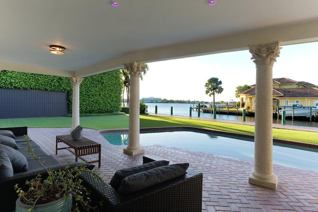 view of patio with a water view