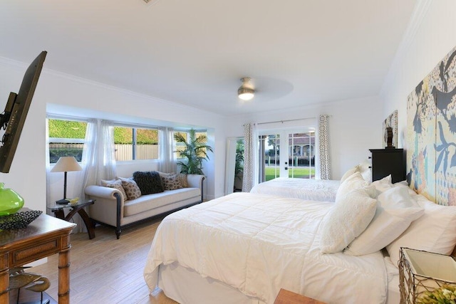 bedroom featuring hardwood / wood-style floors, ceiling fan, and ornamental molding