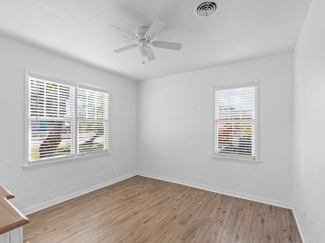 unfurnished room with ceiling fan and light hardwood / wood-style floors