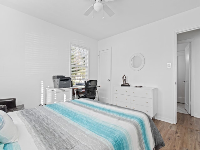 bedroom featuring ceiling fan and light hardwood / wood-style flooring