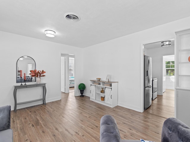 living room with light hardwood / wood-style floors