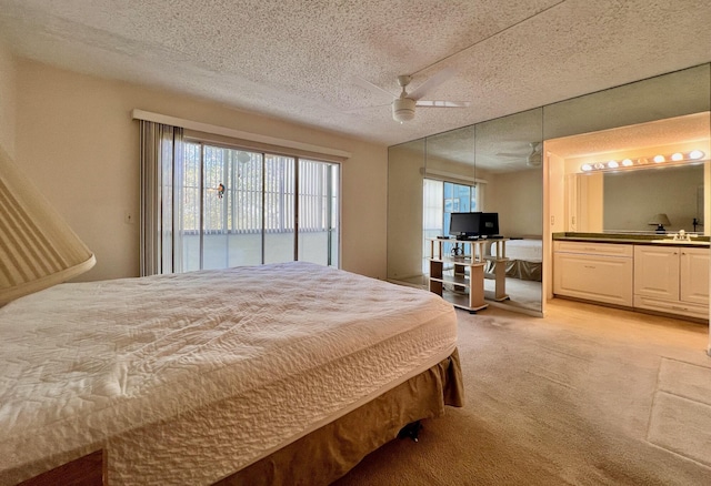 bedroom with access to exterior, ceiling fan, light colored carpet, a textured ceiling, and multiple windows