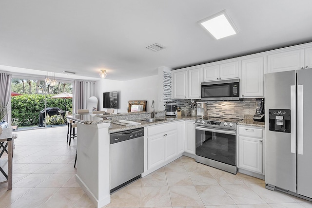 kitchen featuring white cabinetry and stainless steel appliances