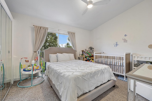 carpeted bedroom featuring ceiling fan and a closet