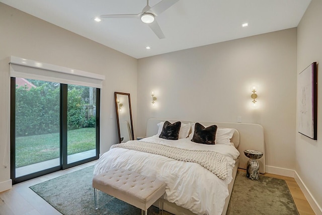 bedroom with access to exterior, light wood-type flooring, and ceiling fan