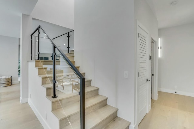 stairs featuring hardwood / wood-style flooring