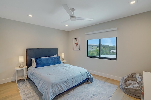 bedroom with ceiling fan and hardwood / wood-style floors